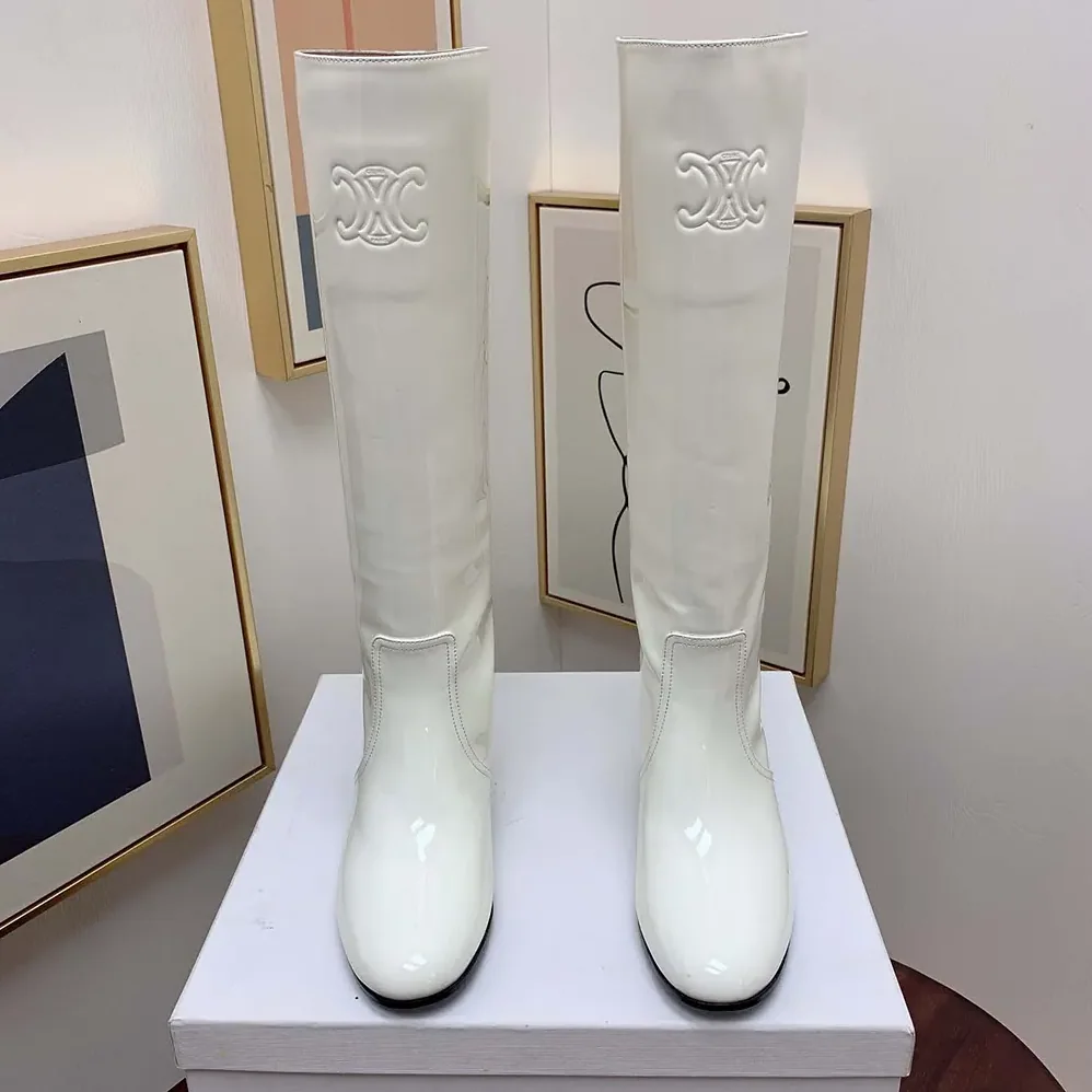 Celine Les Bottes Celine Triomphe High Boot in Patent Calfskin for Women in White