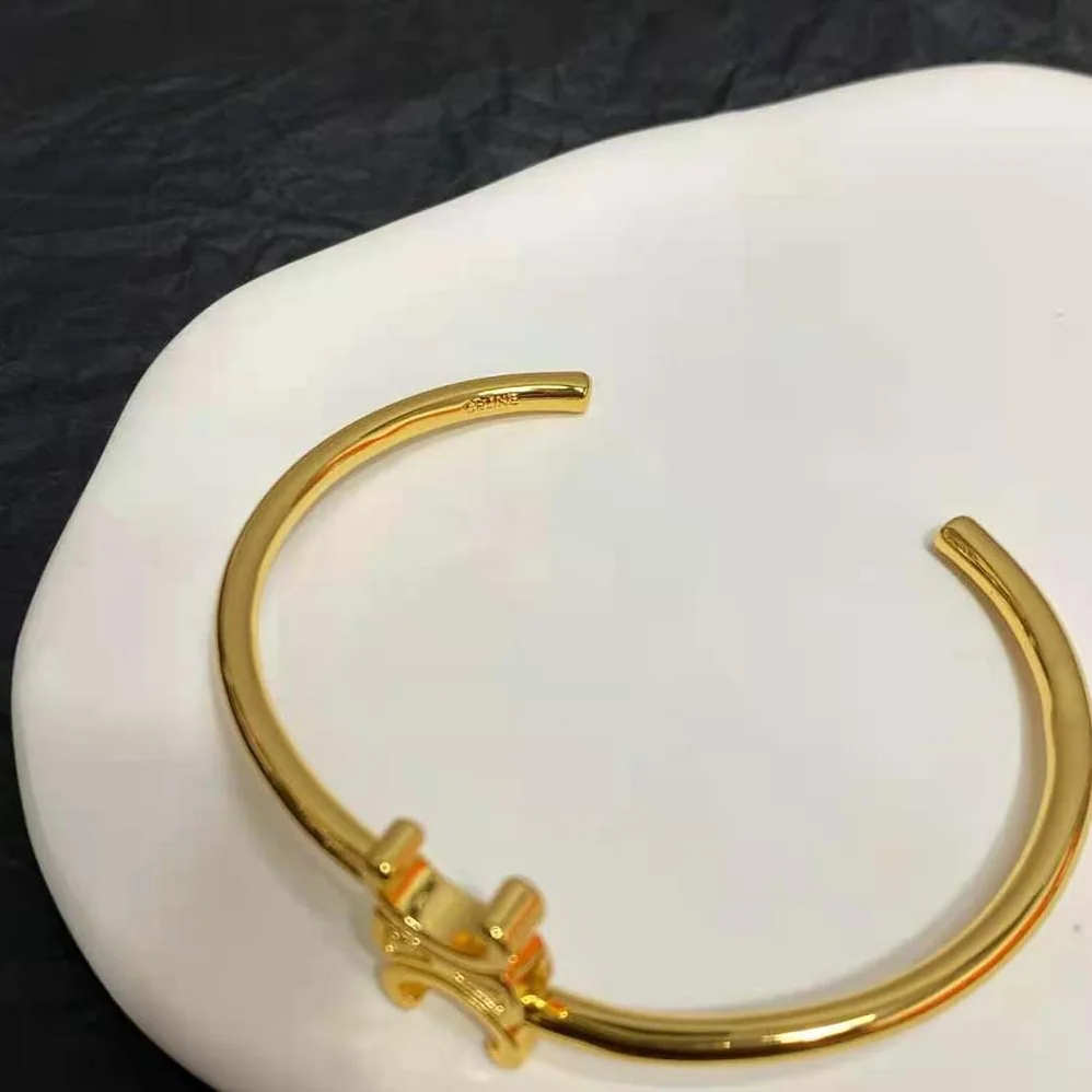 Celine Triomphe Asymmetric Cuff in Brass with Gold Finish for Women Celine Triomphe Asymmetric Cuff in Brass with Gold Finish for Women