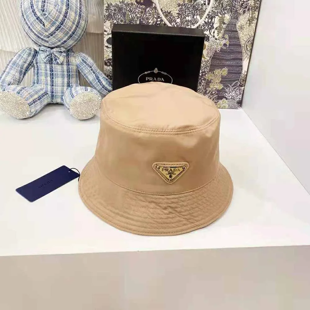 Prada Nylon Bucket Hat Decorated with the Triangle Logo for Women in Sandy Prada Nylon Bucket Hat Decorated with the Triangle Logo for Women in Sandy