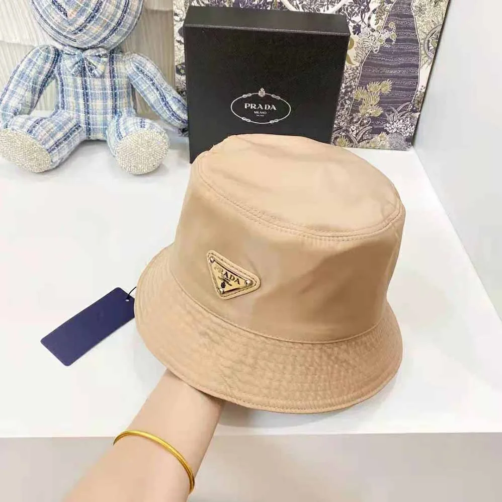 Prada Nylon Bucket Hat Decorated with the Triangle Logo for Women in Sandy Prada Nylon Bucket Hat Decorated with the Triangle Logo for Women in Sandy
