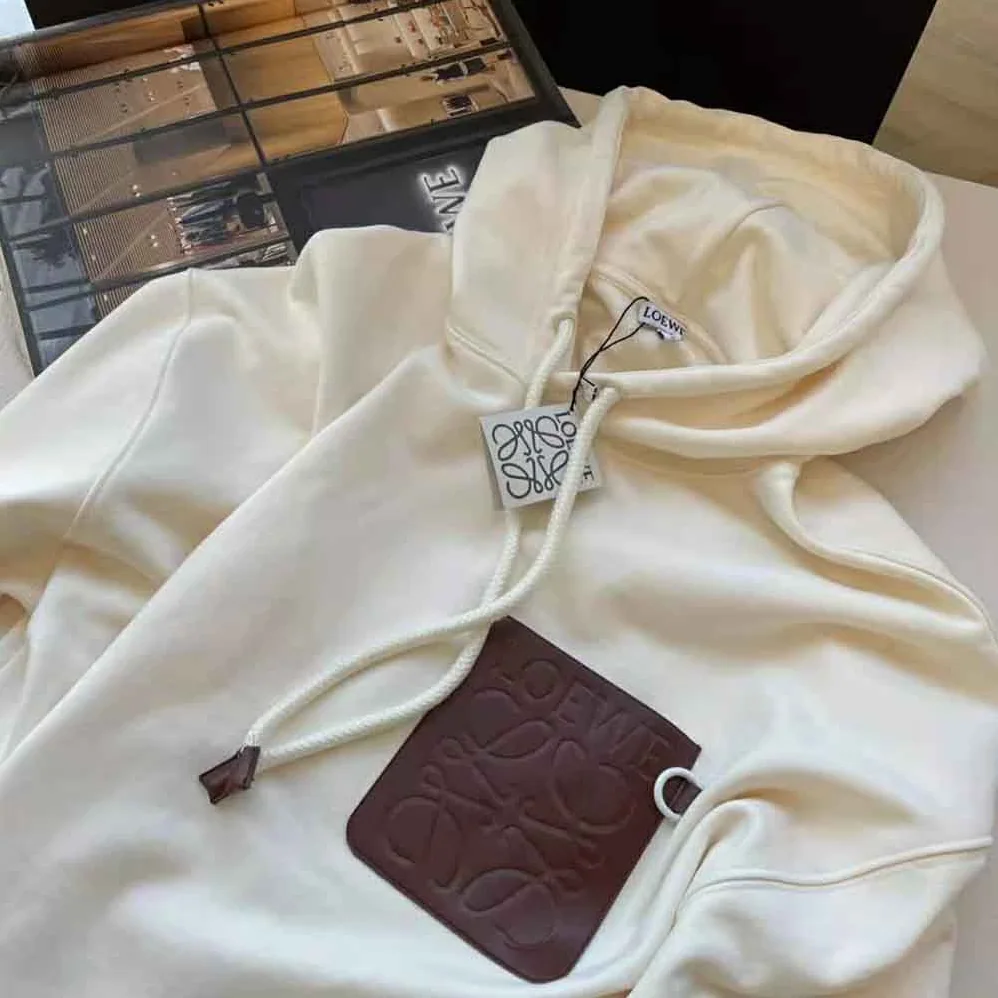 Loewe Anagram Patch Hoodie in Cotton for Women in White Loewe Anagram Patch Hoodie in Cotton for Women in White