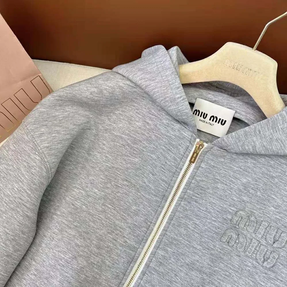 Miu Miu Embroidered Cotton Fleece Hoodie with Embroidered Logo for Women in Silver Miu Miu Embroidered Cotton Fleece Hoodie with Embroidered Logo for Women in Silver