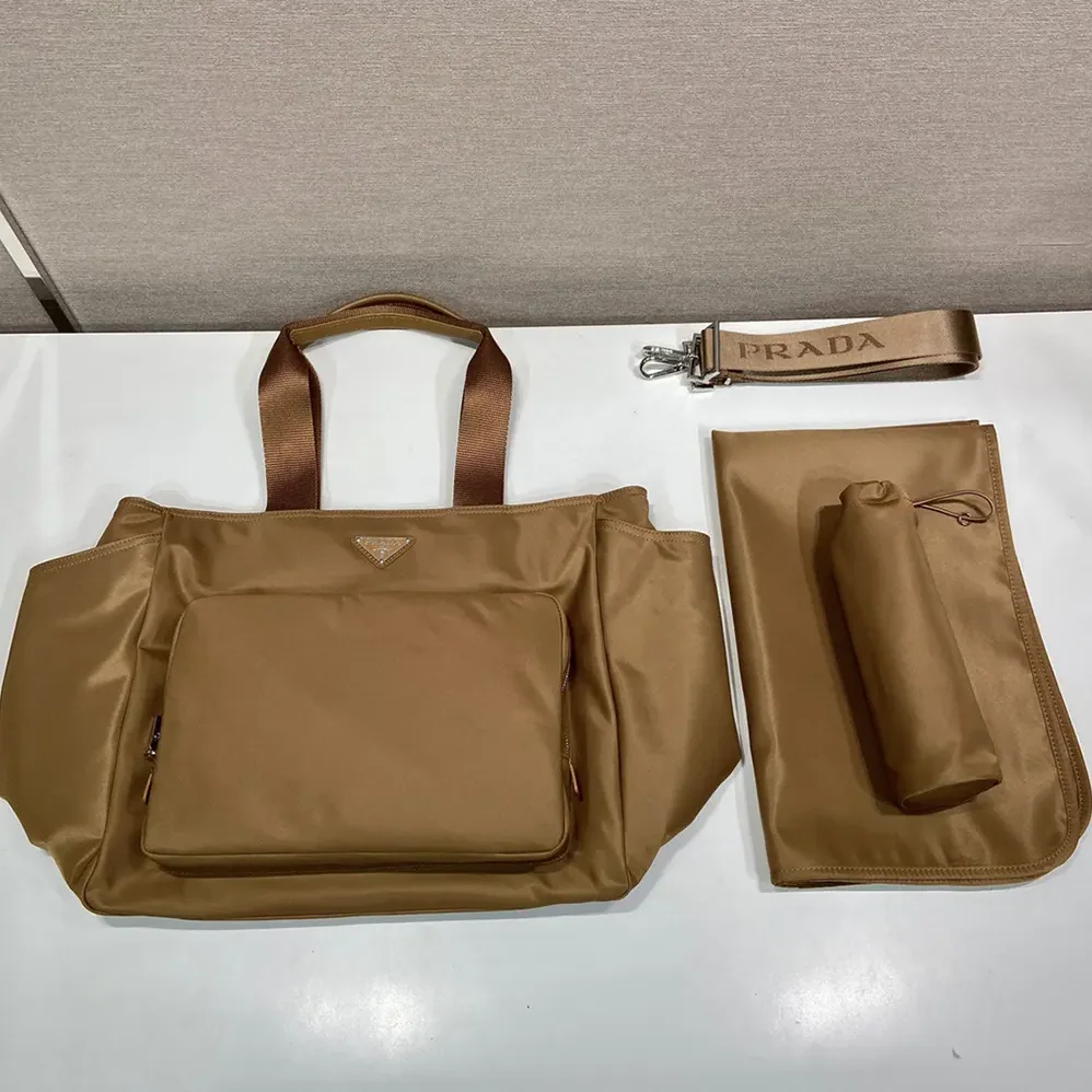 Prada Re-Nylon Baby Bag with Triangle Logo for Unisex in Brown Prada Re-Nylon Baby Bag with Triangle Logo for Unisex in Brown