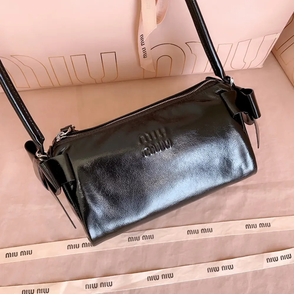 Miu Miu Shiny Leather Pouch for Women in Black Miu Miu Shiny Leather Pouch for Women in Black