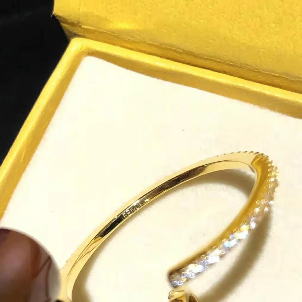 Fendi F is Fendi Earring Gold for Women in color Fendi F is Fendi Earring Gold for Women in color