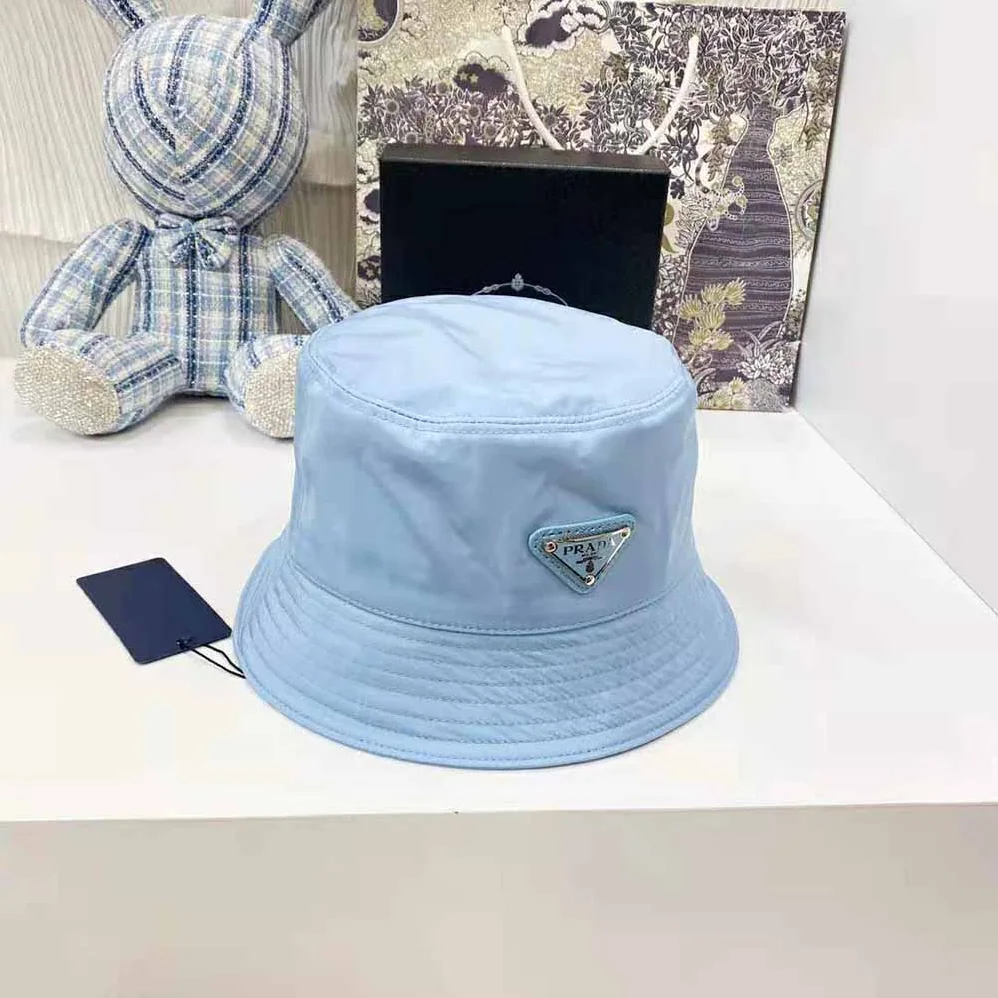 Prada Nylon Bucket Hat Decorated with the Triangle Logo for Women in Blue Prada Nylon Bucket Hat Decorated with the Triangle Logo for Women in Blue