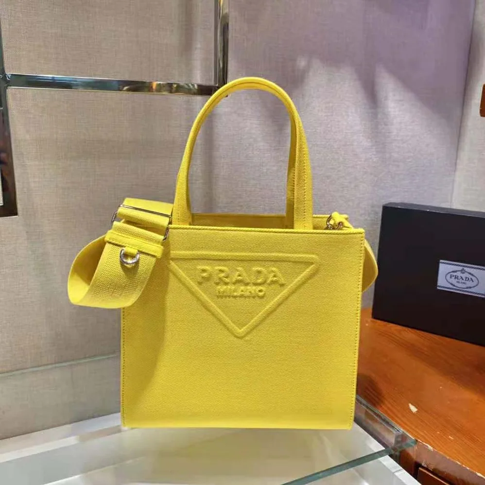 Prada Drill Tote Handles Bag for Women in Yellow Prada Drill Tote Handles Bag for Women in Yellow