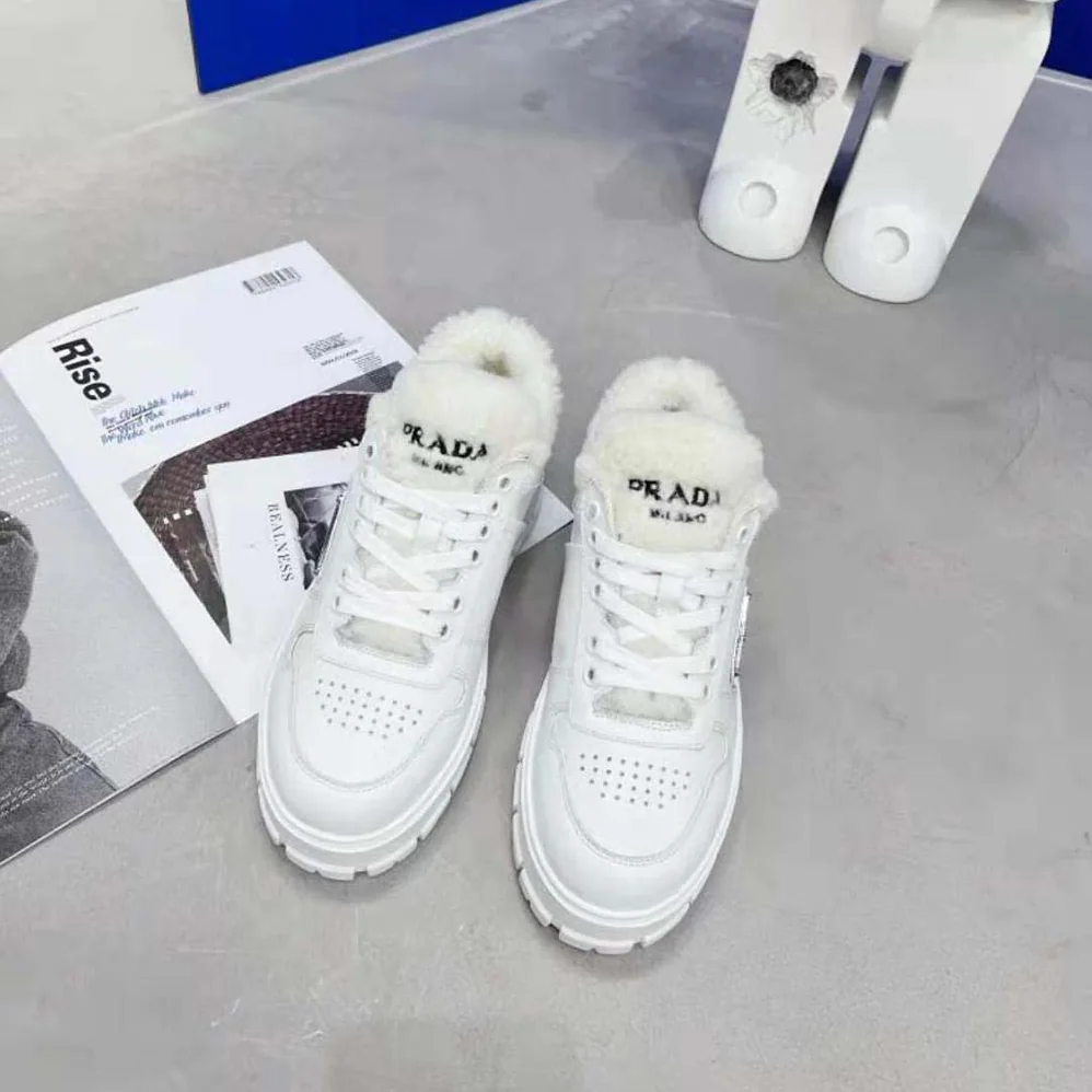 Prada Leather and Shearling Sneakers for Women in White