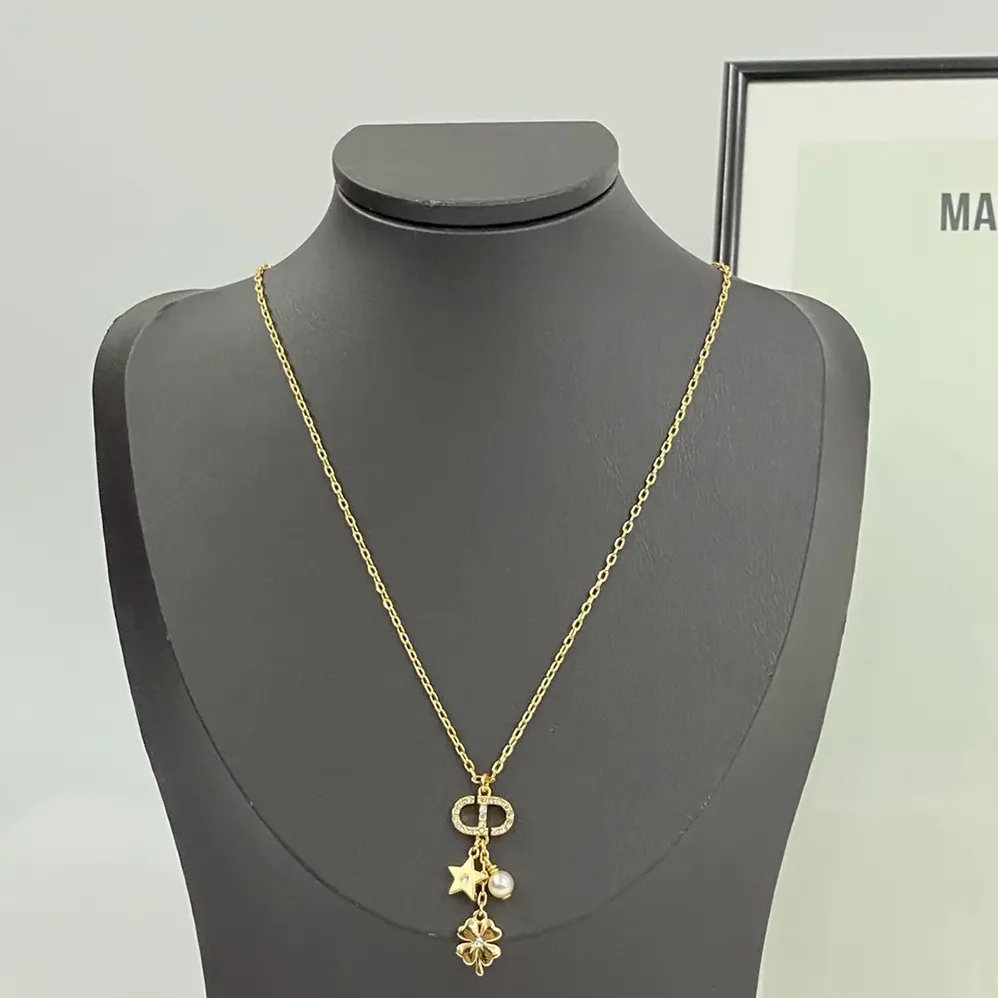 Dior Petit CD Lucky Charms Necklace Gold-Finish Metal with a White Resin Pearl and Silver for Women in Tone Crystals Dior Petit CD Lucky Charms Necklace Gold-Finish Metal with a White Resin Pearl and Silver for Women in Tone Crystals