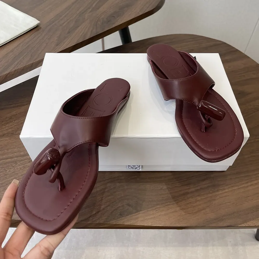 Loewe Toggle Flat Sandal in Shiny Smoot Calfskin for Women in Burnt Red Loewe Toggle Flat Sandal in Shiny Smoot Calfskin for Women in Burnt Red