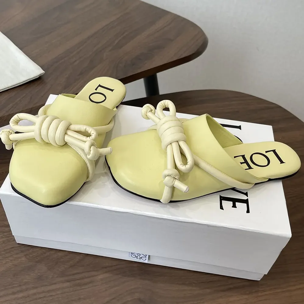 Loewe Flamenco Knot Mule in Lambskin for Women in Yellow Loewe Flamenco Knot Mule in Lambskin for Women in Yellow