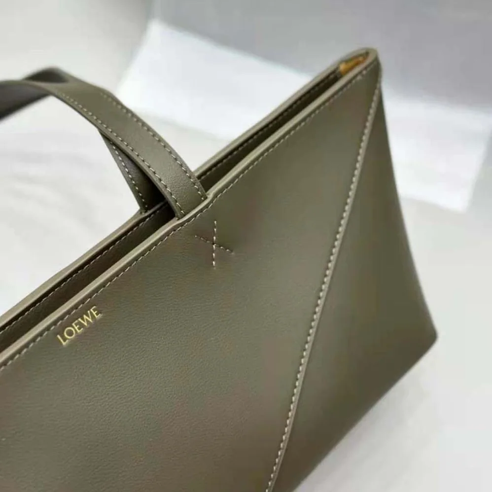 Loewe Cropped Puzzle Fold Bag in Shiny Calfskin for Women in Green Loewe Cropped Puzzle Fold Bag in Shiny Calfskin for Women in Green