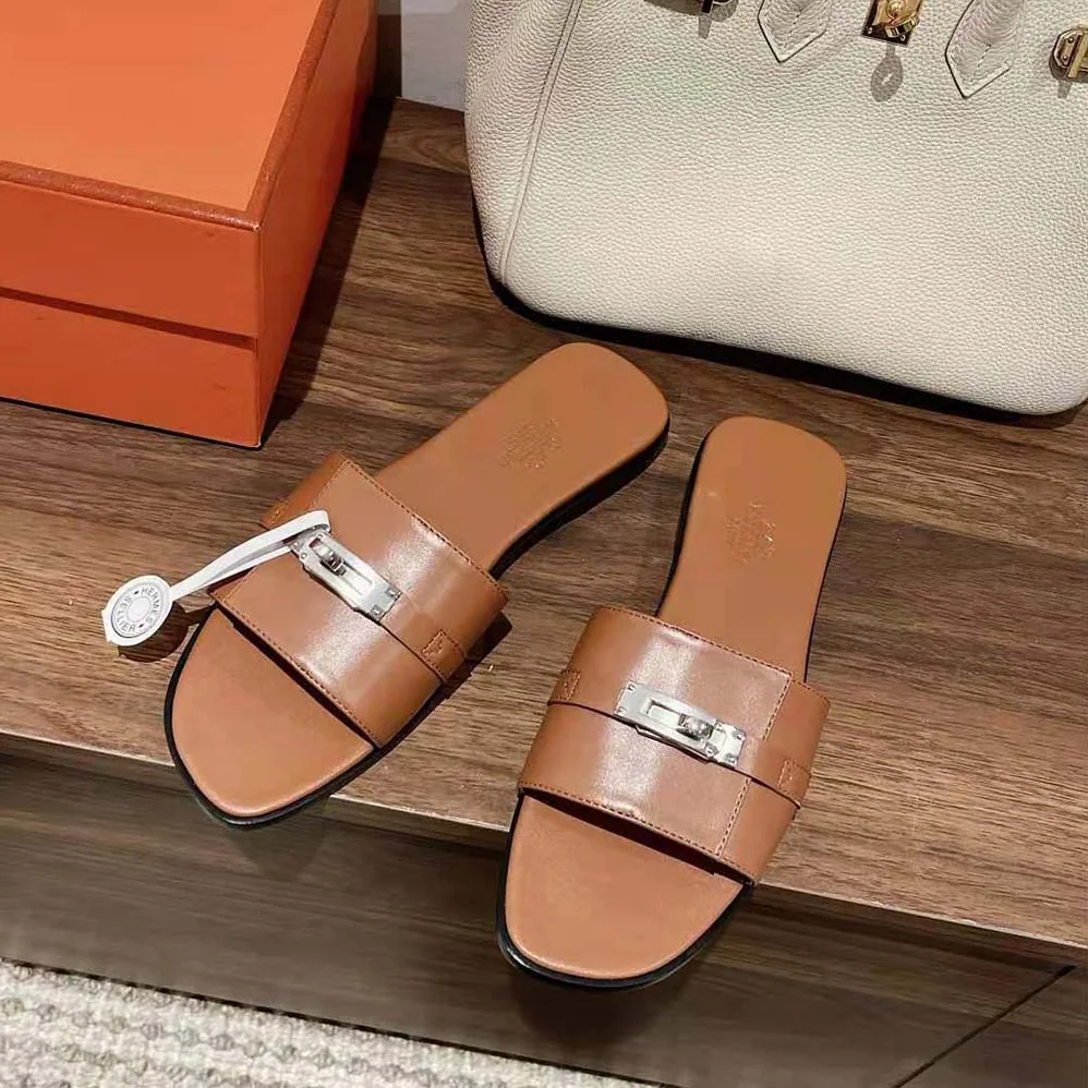Hermes Giulia Sandal in Calfskin with Iconic Palladium-Plated Kelly Buckle for Women in Brown Hermes Giulia Sandal in Calfskin with Iconic Palladium-Plated Kelly Buckle for Women in Brown