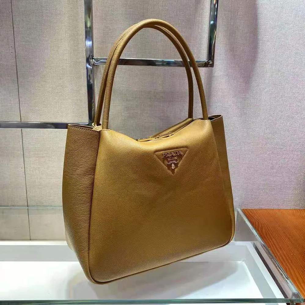 Prada Medium Leather handbag with the Prada Metal Lettering Logo Illuminating Its Center for Women