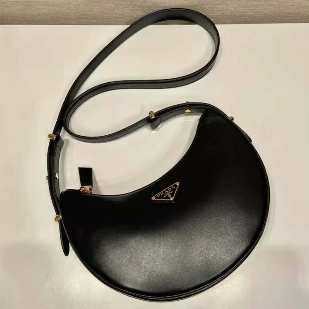 Prada Leather Shoulder Bag with Enameled Metal Triangle Logo for Women in Black