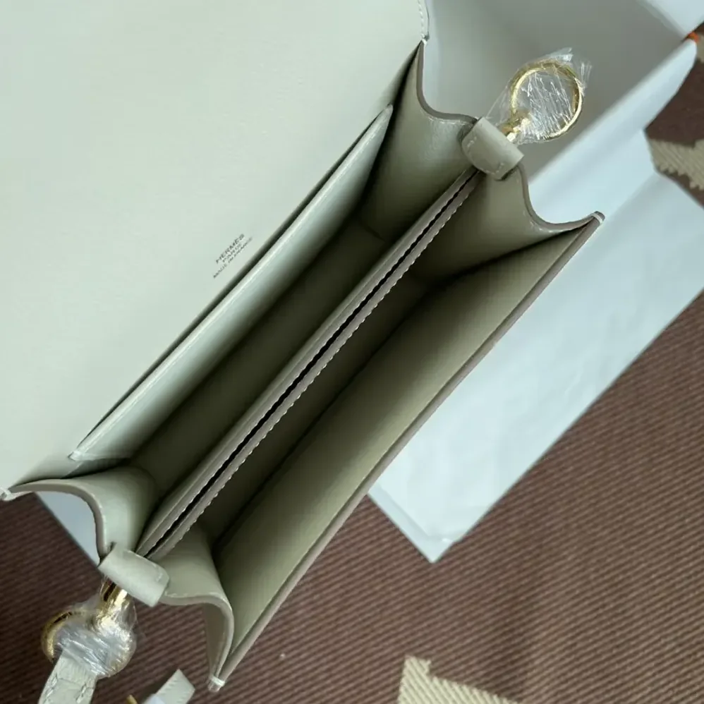 Hermes Roulis Mini Bag in Evercolor Calfskin for Women in White/Gold Hermes Roulis Mini Bag in Evercolor Calfskin for Women in White/Gold