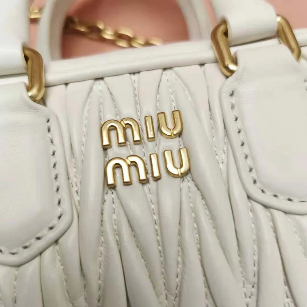 Miu Miu Matelassé Nappa Leather Top-Handle Mini-Bag for Women in White Miu Miu Matelassé Nappa Leather Top-Handle Mini-Bag for Women in White