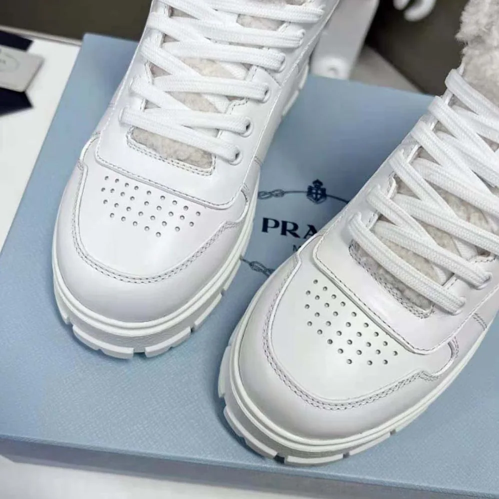 Prada Leather and Shearling High-Top Sneakers for Women in White Prada Leather and Shearling High-Top Sneakers for Women in White