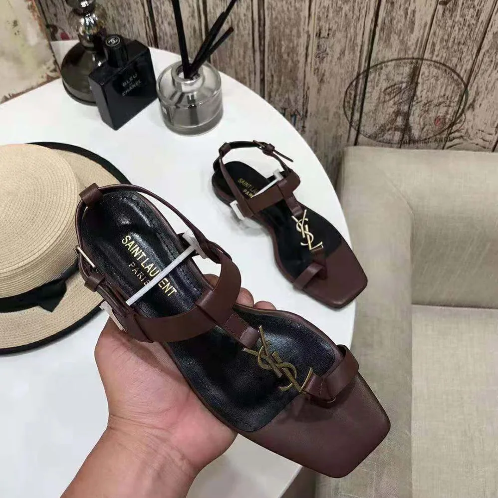 Saint Laurent YSL Cassandra Flat Sandals in Smooth Leather with Gold-Tone Monogram for Women in Brown