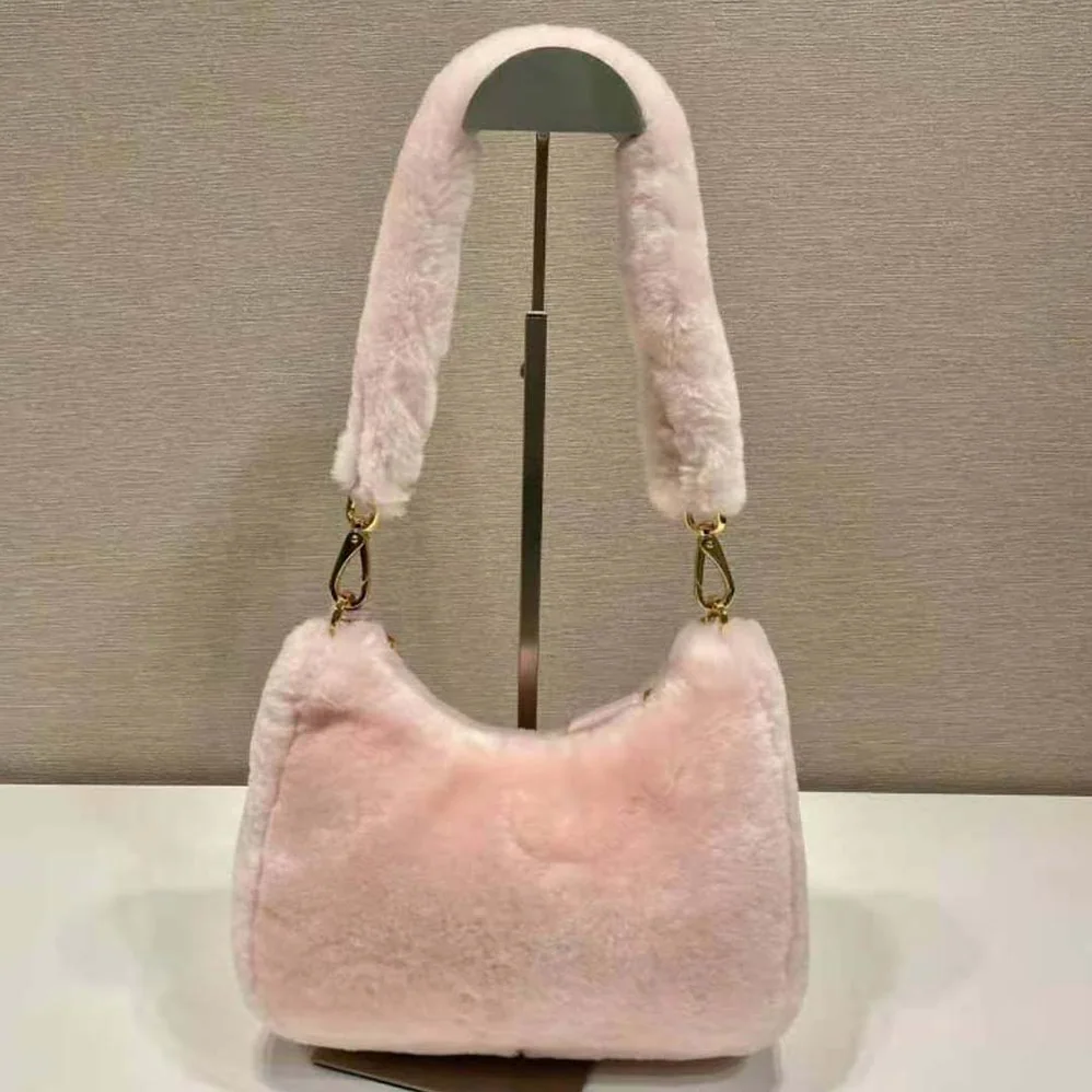 Prada Shearling Mini-Bag with the Enameled Metal Triangle Logo for Women in Pink Prada Shearling Mini-Bag with the Enameled Metal Triangle Logo for Women in Pink