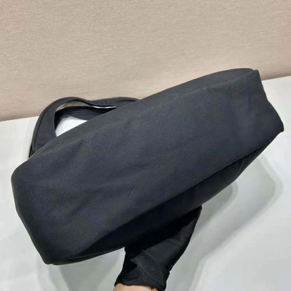 Prada Canvas Hobo Bag with Embossed Logo on the Front for Men in Black Prada Canvas Hobo Bag with Embossed Logo on the Front for Men in Black