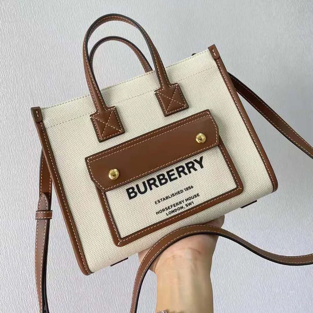 Burberry Mini Two-tone Canvas and Leather Freya Bag for Women in Brown Burberry Mini Two-tone Canvas and Leather Freya Bag for Women in Brown