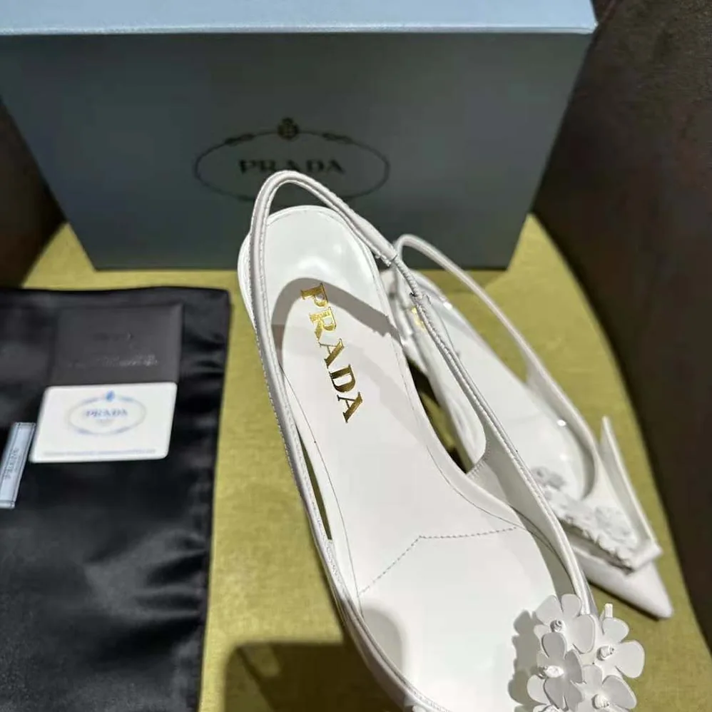 Prada Brushed Leather Slingback Pumps with Floral Appliques for Women in White Prada Brushed Leather Slingback Pumps with Floral Appliques for Women in White