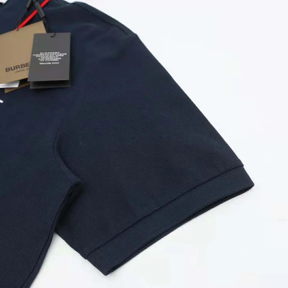 Burberry Icon Stripe Placket Cotton Piqué Polo Shirt for Men in Navy Burberry Icon Stripe Placket Cotton Piqué Polo Shirt for Men in Navy