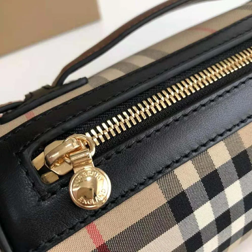 Burberry The Icon Stripe E-canvas and Leather Barrel Bag for Women in Brown Burberry The Icon Stripe E-canvas and Leather Barrel Bag for Women in Brown