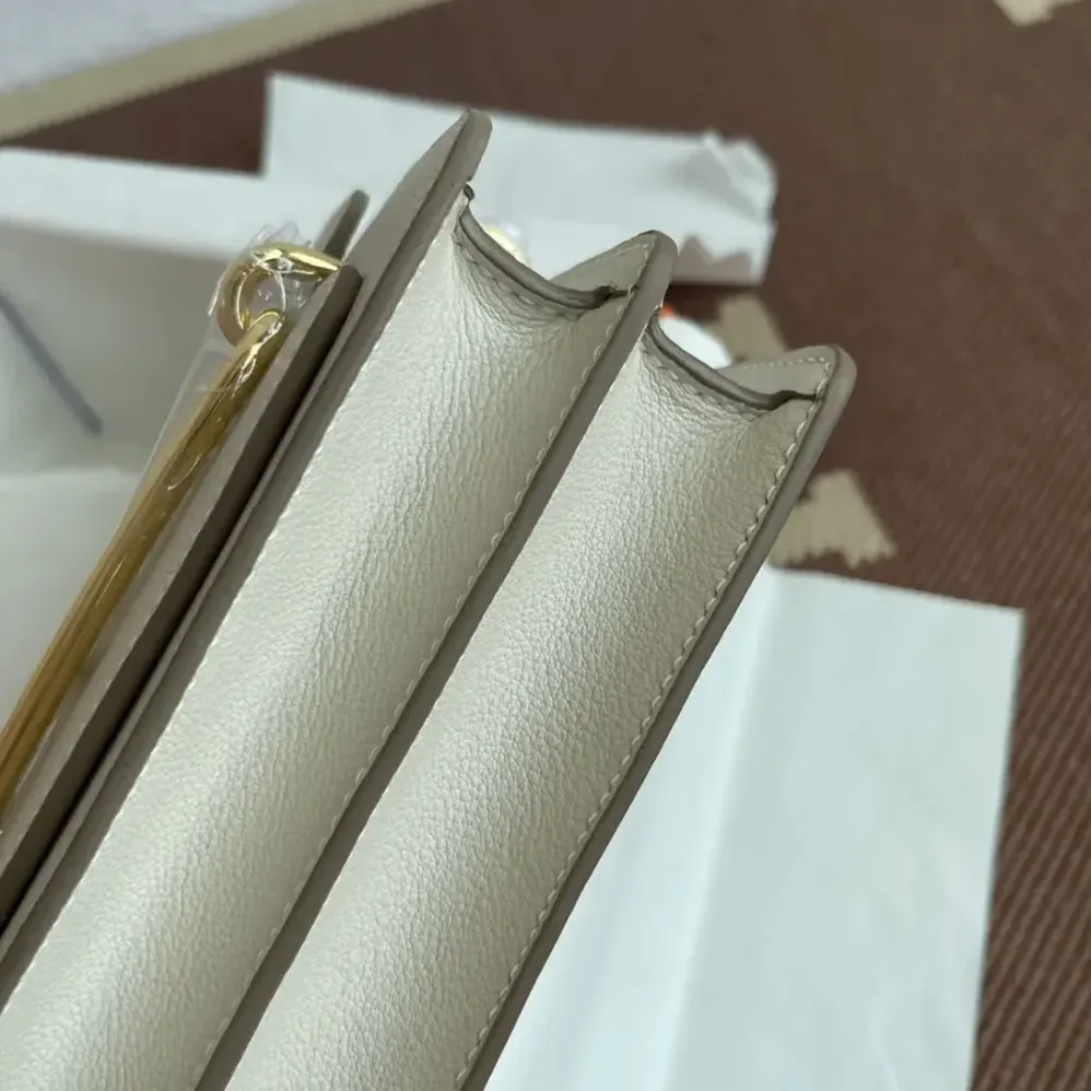 Hermes Roulis Mini Bag in Evercolor Calfskin for Women in White/Gold Hermes Roulis Mini Bag in Evercolor Calfskin for Women in White/Gold
