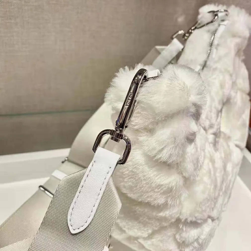 Prada A Patchwork-style Triangle Motif Characterizes Shearling Shoulder Bag for Women Prada A Patchwork-style Triangle Motif Characterizes Shearling Shoulder Bag for Women