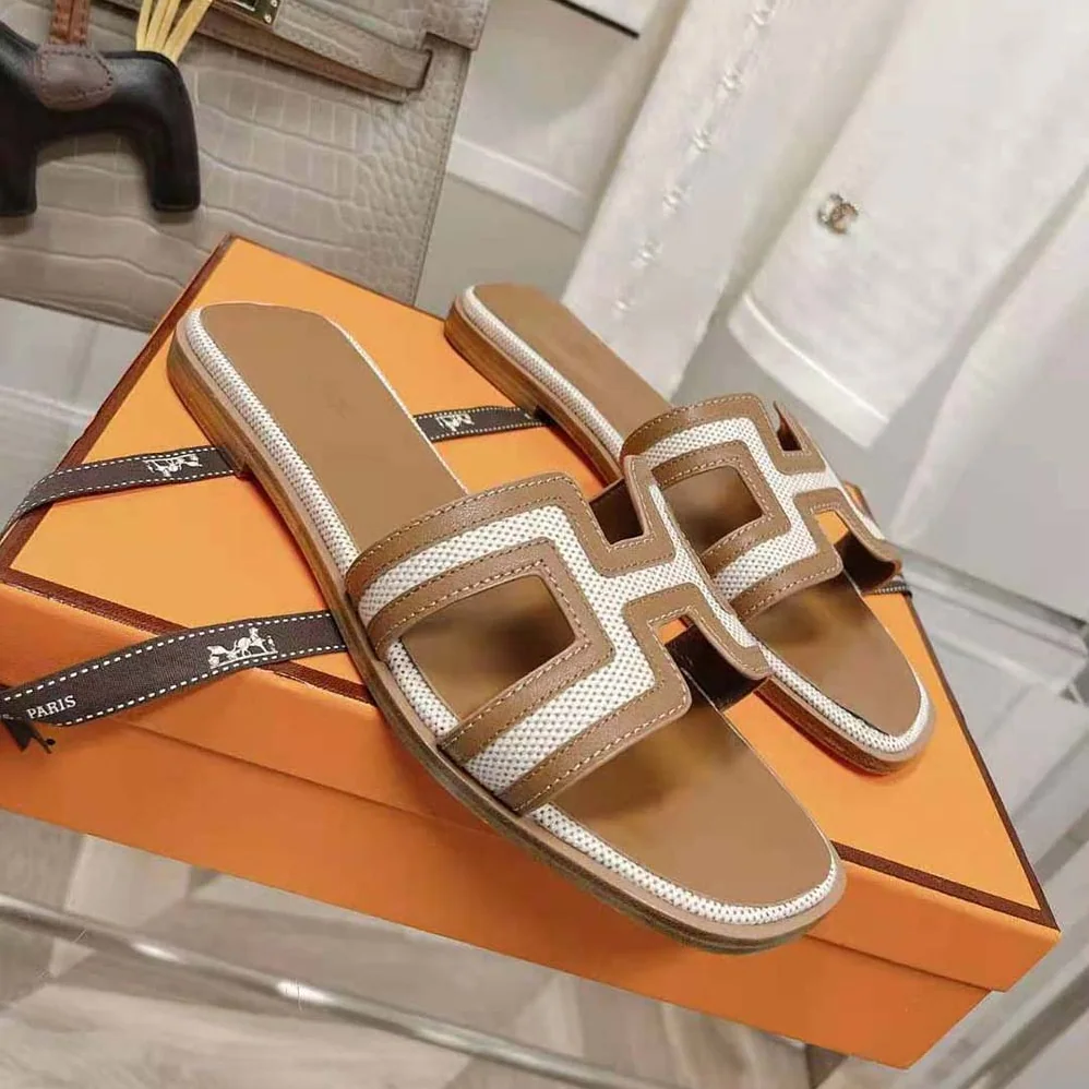 Hermes Oran Sandal in Calfskin and H Canvas with Iconic H Cut for Women in Out Hermes Oran Sandal in Calfskin and H Canvas with Iconic H Cut for Women in Out
