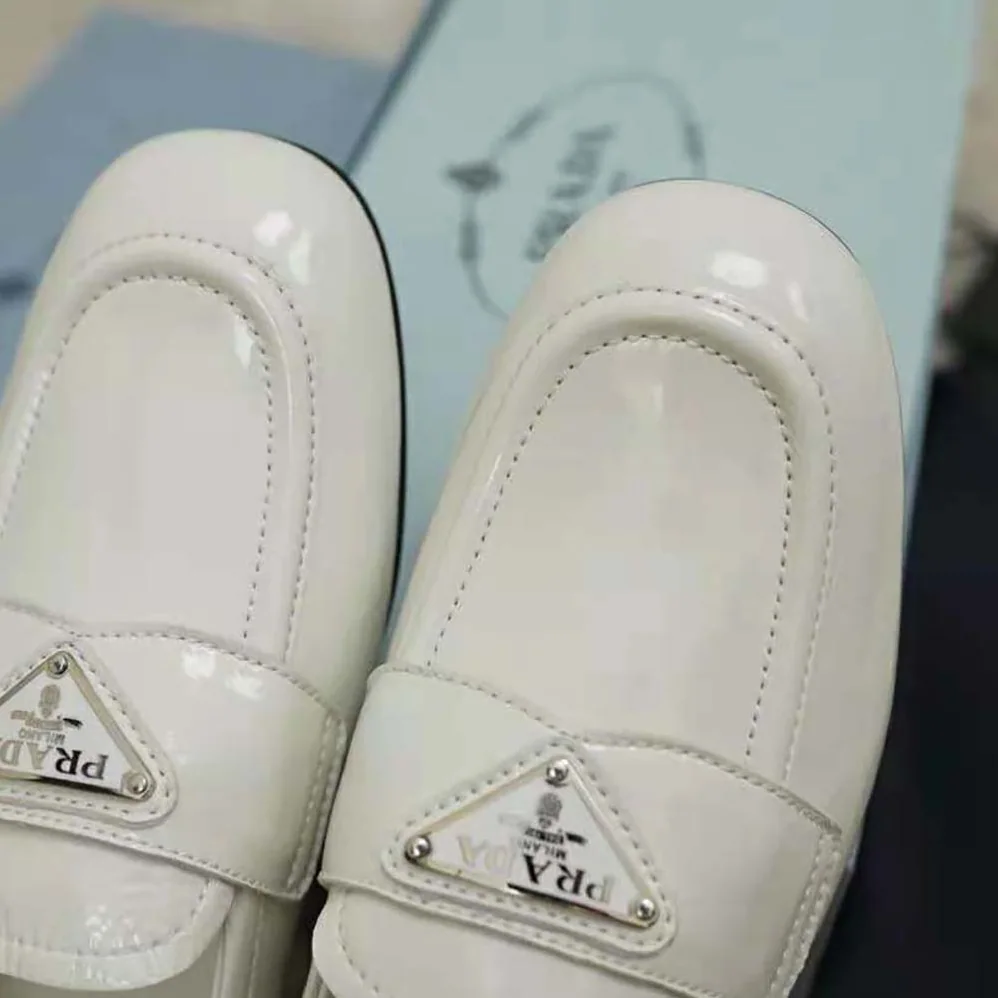 Prada Patent Leather Loafers in 5mm Heel for Women in White Prada Patent Leather Loafers in 5mm Heel for Women in White