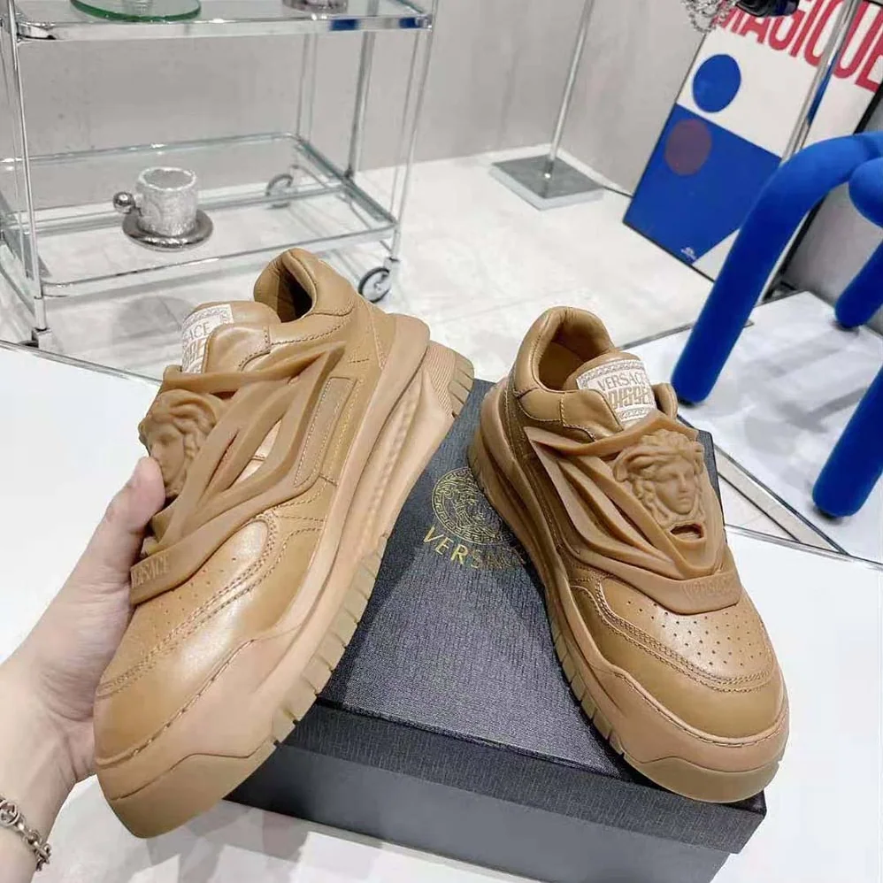 Versace Odissea Sneakers are Set on Rubber Soles with Perforated Toe Caps for Unisex in Brown Versace Odissea Sneakers are Set on Rubber Soles with Perforated Toe Caps for Unisex in Brown