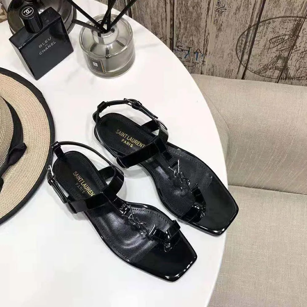 Saint Laurent YSL Cassandra Flat Sandals in Patent Leather with Silver for Women in Tone Monogram