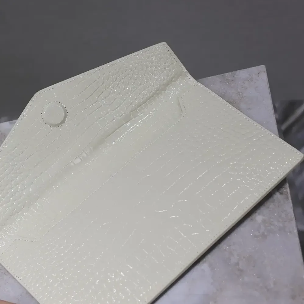 Saint Laurent YSL Uptown Pouch in Crocodile-embossed Shiny Leather for Women in White