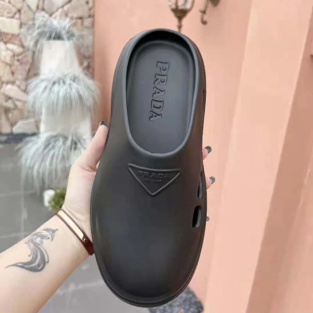 Prada Foam Rubber Mules With Embossed Rubber Triangle Logo for Women in Black Prada Foam Rubber Mules With Embossed Rubber Triangle Logo for Women in Black