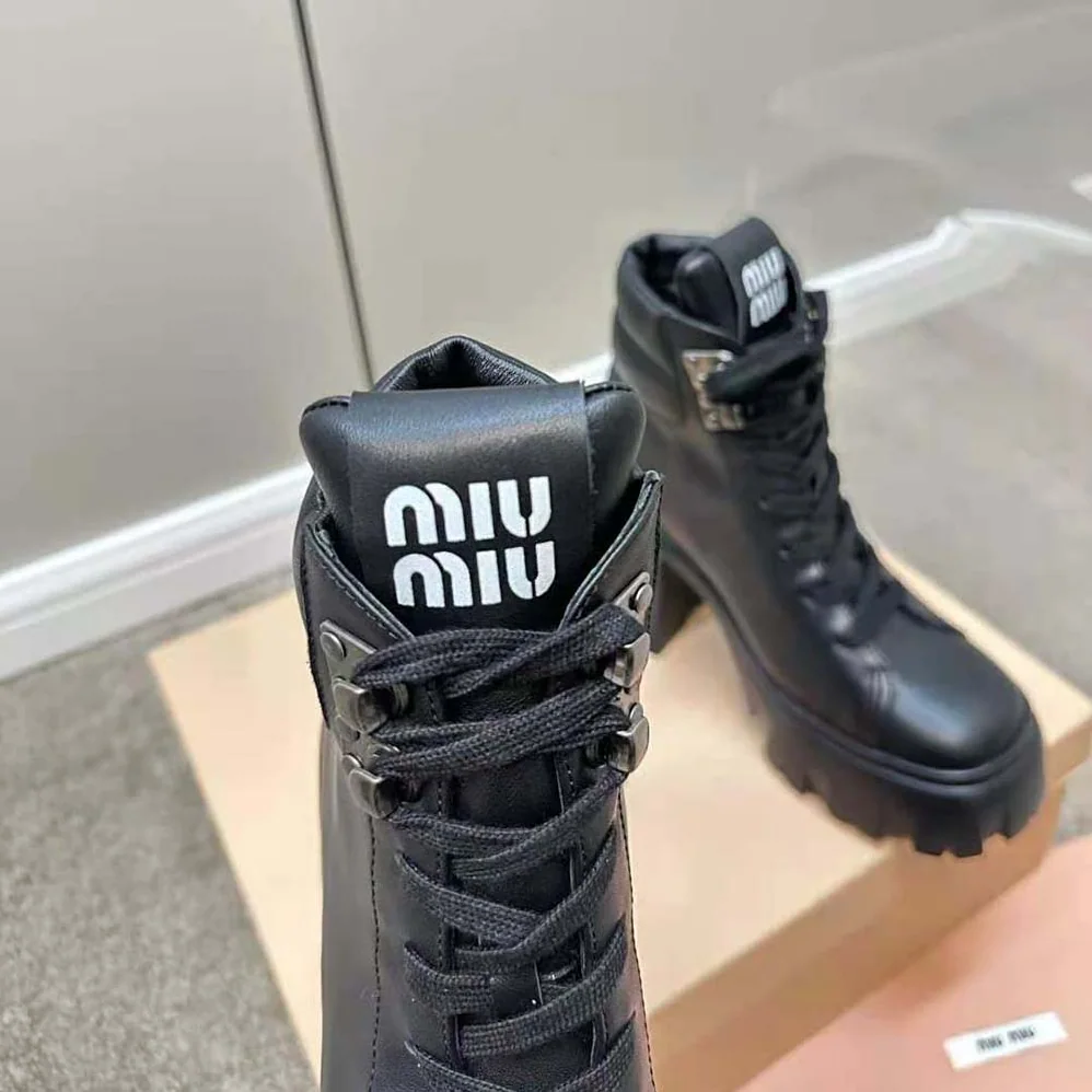 Miu Miu Leather Booties with EVA Sole with Logo for Women in Black Miu Miu Leather Booties with EVA Sole with Logo for Women in Black
