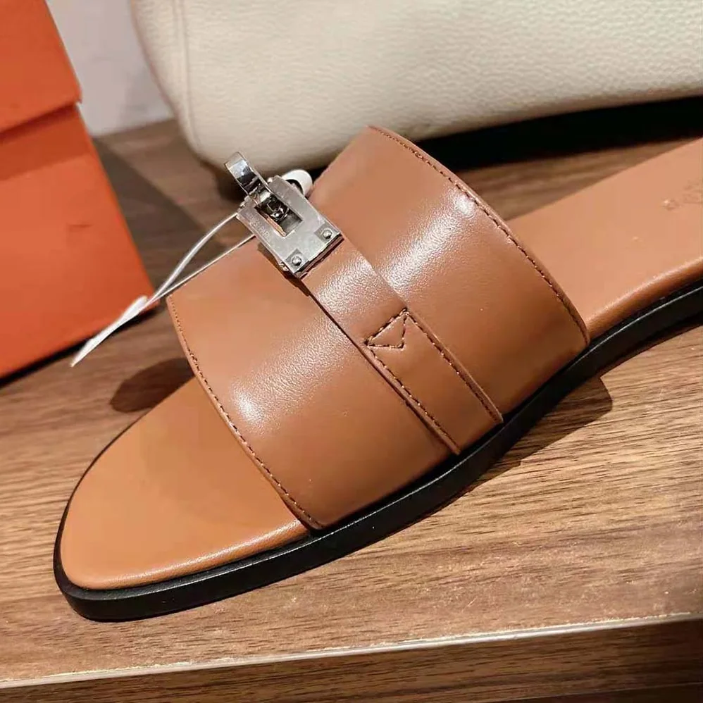 Hermes Giulia Sandal in Calfskin with Iconic Palladium-Plated Kelly Buckle for Women in Brown Hermes Giulia Sandal in Calfskin with Iconic Palladium-Plated Kelly Buckle for Women in Brown