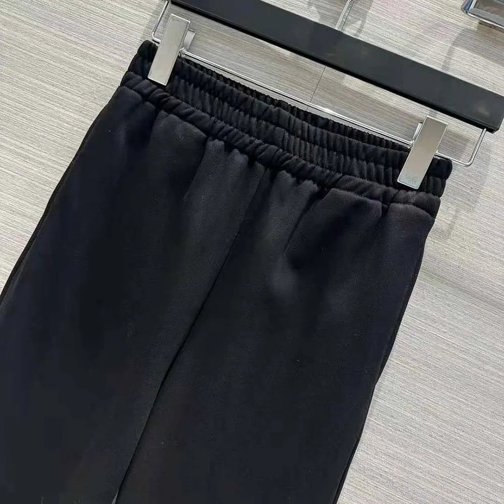 Prada Cotton Fleece Joggers with Feather Trim for Women in Black Prada Cotton Fleece Joggers with Feather Trim for Women in Black