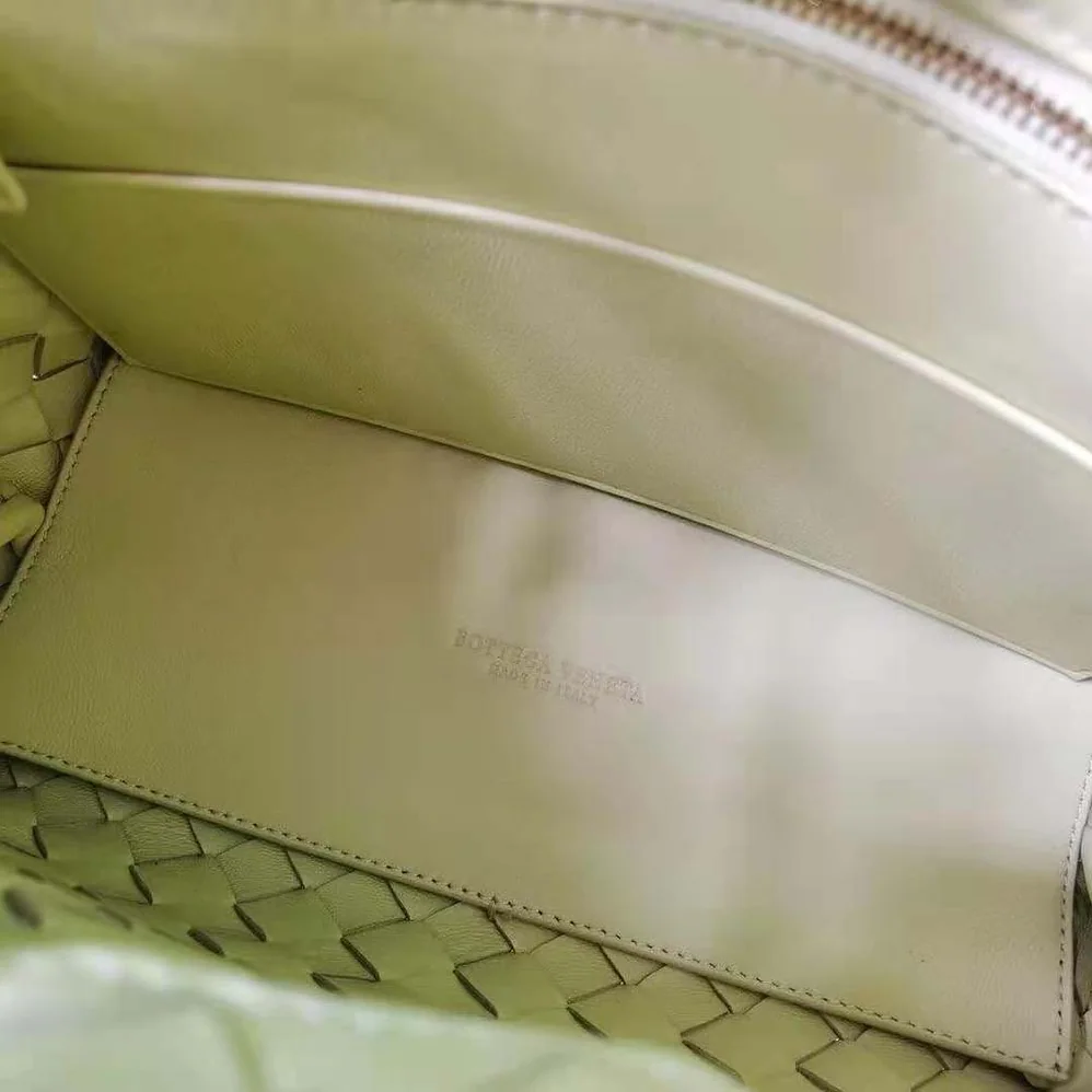 Bottega Veneta Small Andiamo Intrecciato Leather Top Handle Bag for Women in Yellow
