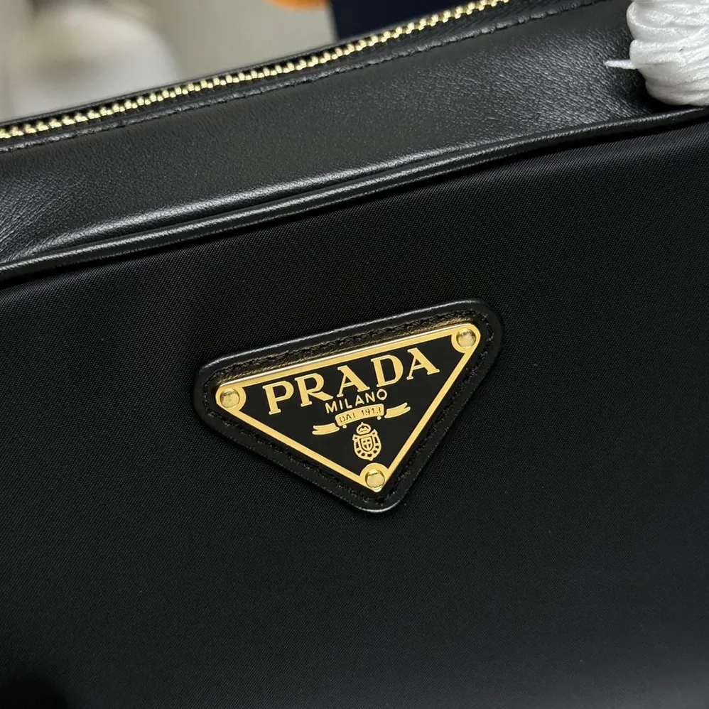 Prada Re-Nylon and Leather Small Top for Women in handle Bag with Padlock Prada Re-Nylon and Leather Small Top for Women in handle Bag with Padlock