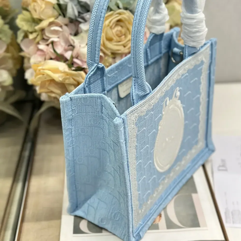 Dior Small Dior Book Tote with Strap Celestial Blue Dior Oblique Embroidery with White Lace and Dior Médaillon for Women Dior Small Dior Book Tote with Strap Celestial Blue Dior Oblique Embroidery with White Lace and Dior Médaillon for Women