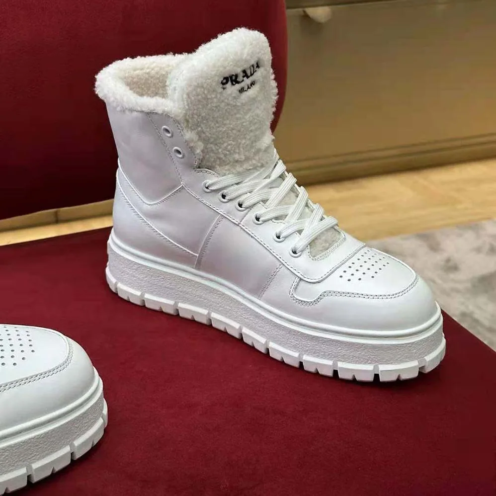 Prada Leather and Shearling High-Top Sneakers for Women in White Prada Leather and Shearling High-Top Sneakers for Women in White