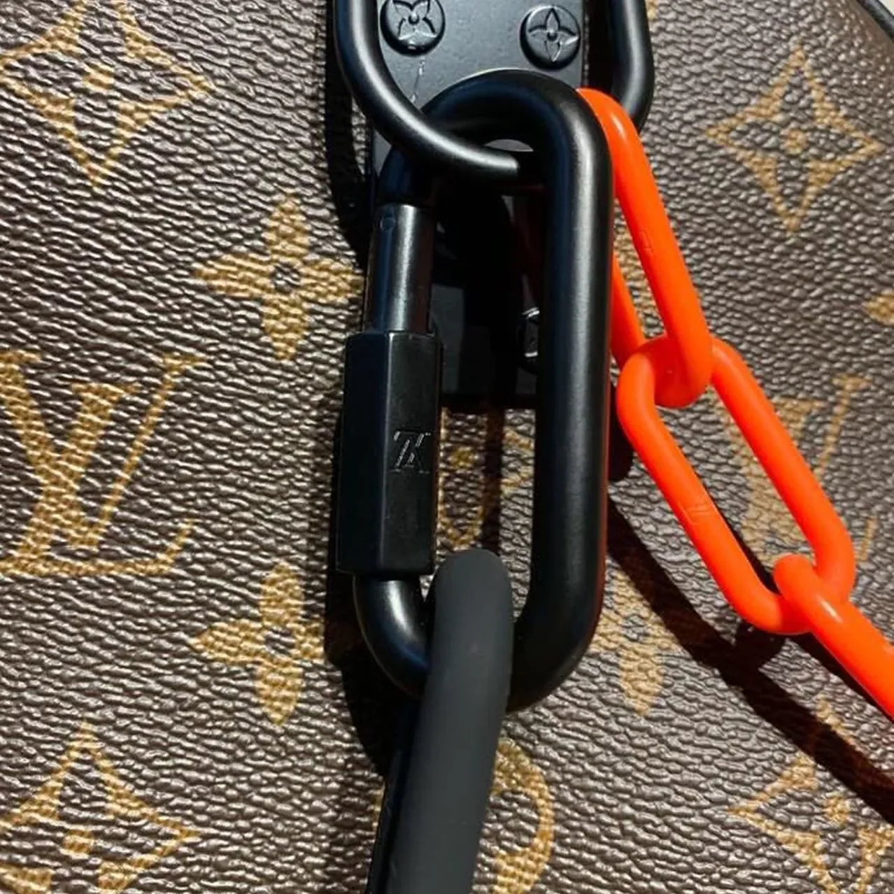 Louis Vuitton Keepall Bandouliere 50 Travel Bag / Black in Orange Monogram Black Hardware Louis Vuitton Keepall Bandouliere 50 Travel Bag / Black in Orange Monogram Black Hardware