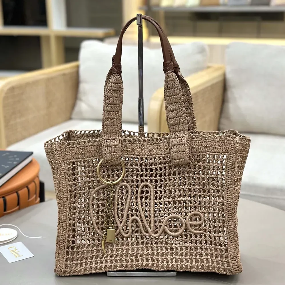 Chloe Summer Banana East-west Tote Bag in Raffia & Buffalo Leather for Women in Beige Chloe Summer Banana East-west Tote Bag in Raffia & Buffalo Leather for Women in Beige