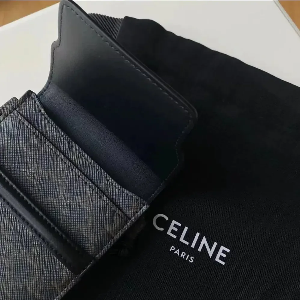 Celine Phone Pouch with Flap in Triomphe Canvas and Lambskin for Women in Black Celine Phone Pouch with Flap in Triomphe Canvas and Lambskin for Women in Black