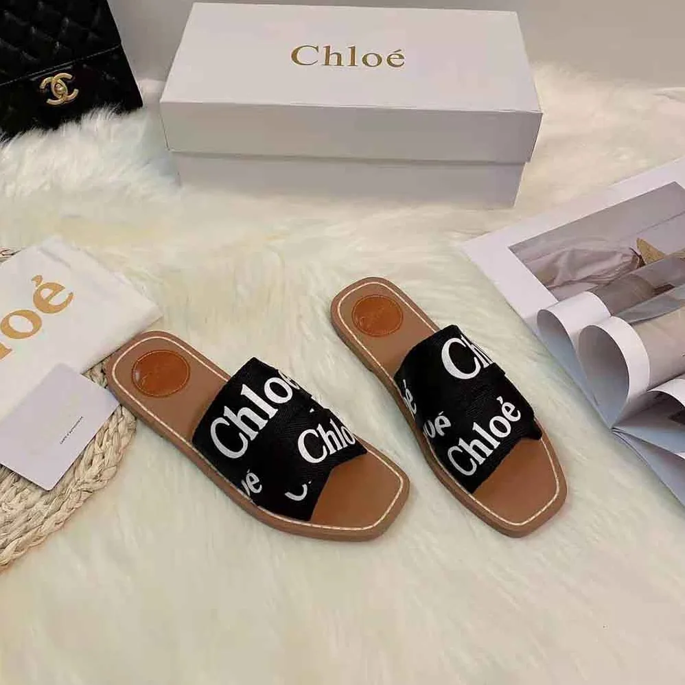 Chloe Woody Flat Mule in Canvas for Women in Black Chloe Woody Flat Mule in Canvas for Women in Black