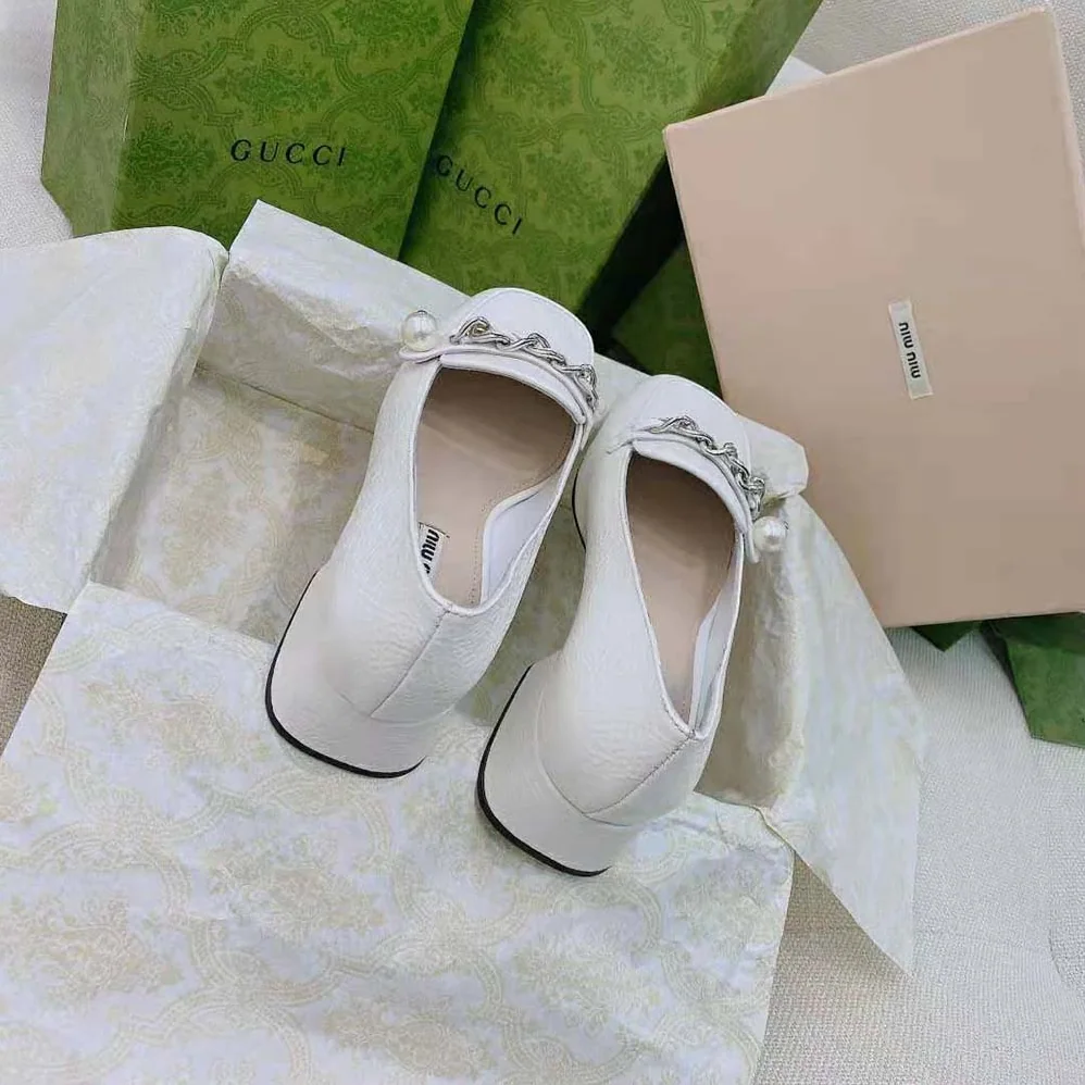Miu Miu Patent Leather Loafers in 35mm Heel for Women in White Miu Miu Patent Leather Loafers in 35mm Heel for Women in White