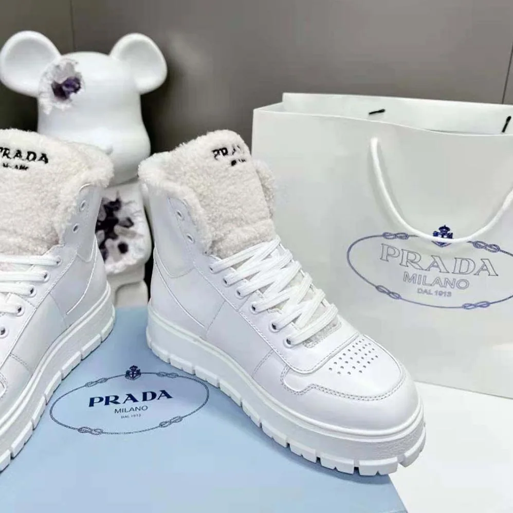 Prada Leather and Shearling High-Top Sneakers for Women in White Prada Leather and Shearling High-Top Sneakers for Women in White